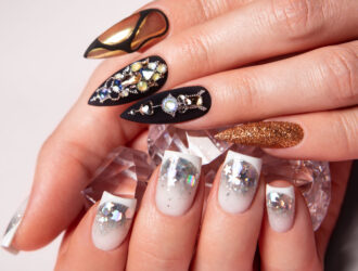 Two different manicures, black and white. . High-quality photo